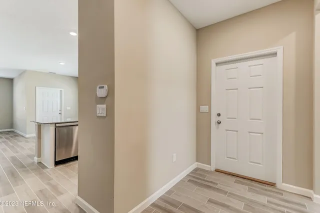 a view of a kitchen from the hallway