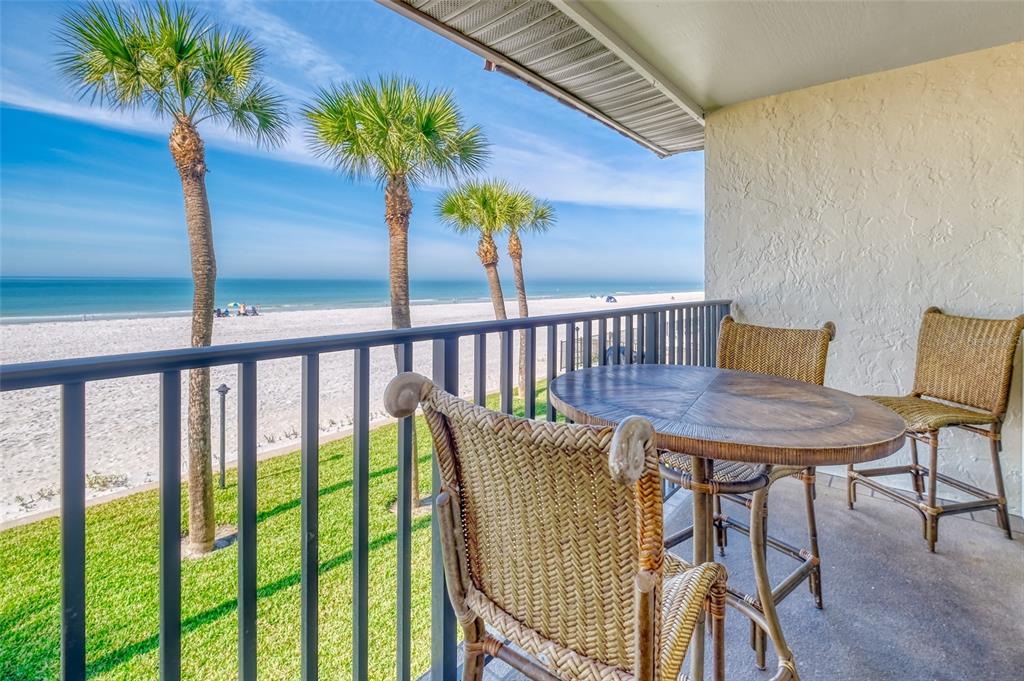 60 Gulf Boulevard, Unit 204 Indian Rocks Beach, FL 33785 - Photo 13 of 45 a view of a balcony with furniture