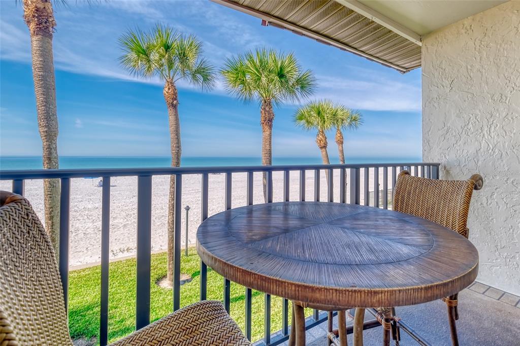 60 Gulf Boulevard, Unit 204 Indian Rocks Beach, FL 33785 - Photo 2 of 45 a view of a dining room with furniture window and wooden floor