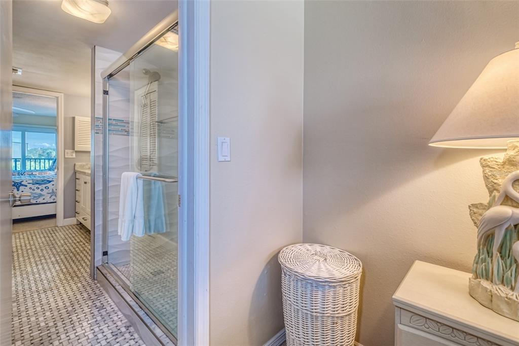 60 Gulf Boulevard, Unit 204 Indian Rocks Beach, FL 33785 - Photo 23 of 45 a bathroom with a sink toilet and shower