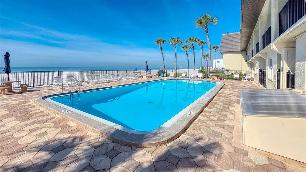 60 Gulf Boulevard, Unit 204 Indian Rocks Beach, FL 33785 - Photo 27 of 45 view of a swimming pool with a lounge chairs