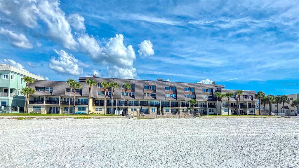 60 Gulf Boulevard, Unit 204 Indian Rocks Beach, FL 33785 - Photo 45 of 45 a view of a building with a swimming pool