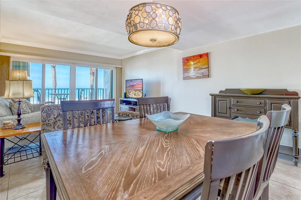 60 Gulf Boulevard, Unit 204 Indian Rocks Beach, FL 33785 - Photo 10 of 45 a view of a dining room with furniture