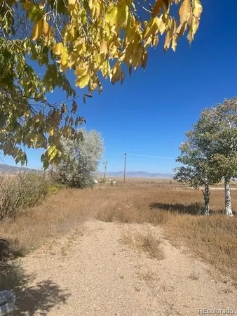 a view of beach and yard