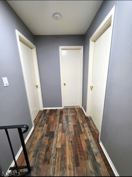 1030 Robin Road Hillsborough, NJ 08844 - Photo 15 of 22 a view of a room with wooden floor and staircase