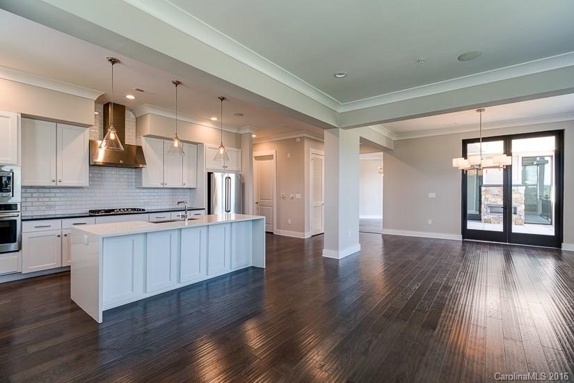 1440 Harding Place, Unit 446 Charlotte, NC 28204 - Photo 8 of 19 a large kitchen with a large window a counter space and stainless steel appliances