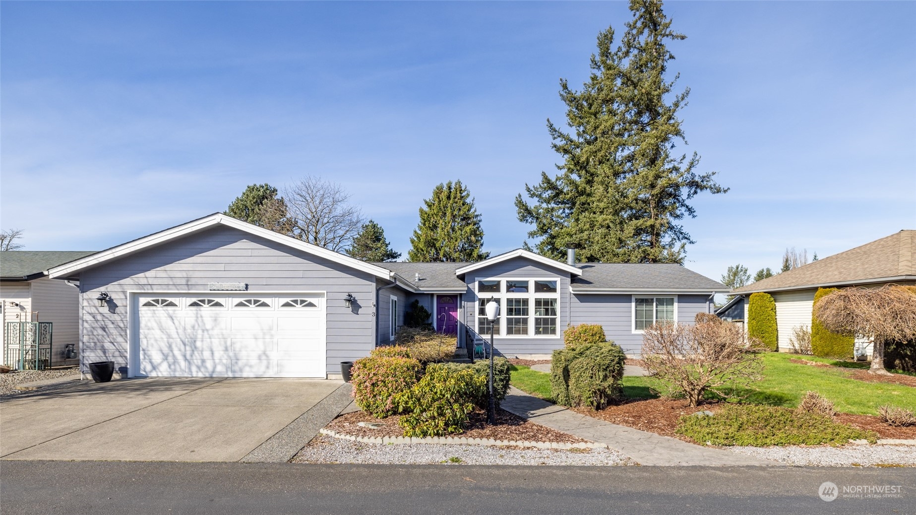 107 South Pass Road, Unit 3 Nooksack, WA 98276 - Photo 1 of 38 a front view of a house with a garden