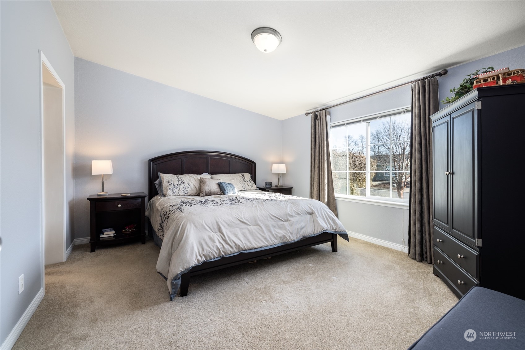 107 South Pass Road, Unit 3 Nooksack, WA 98276 - Photo 15 of 38 a bedroom with a bed and a large window