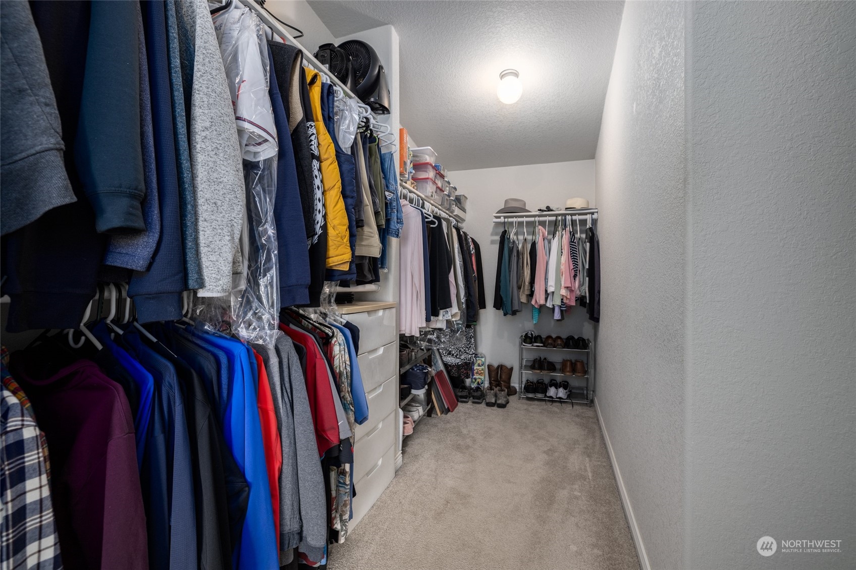 107 South Pass Road, Unit 3 Nooksack, WA 98276 - Photo 17 of 38 a view of walk in closet with clothes