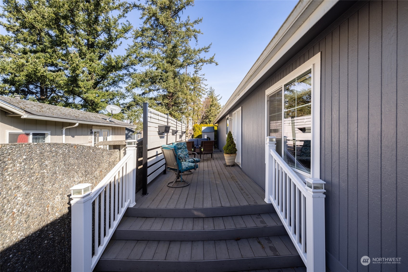 107 South Pass Road, Unit 3 Nooksack, WA 98276 - Photo 27 of 38 a view of a house with wooden deck and furniture