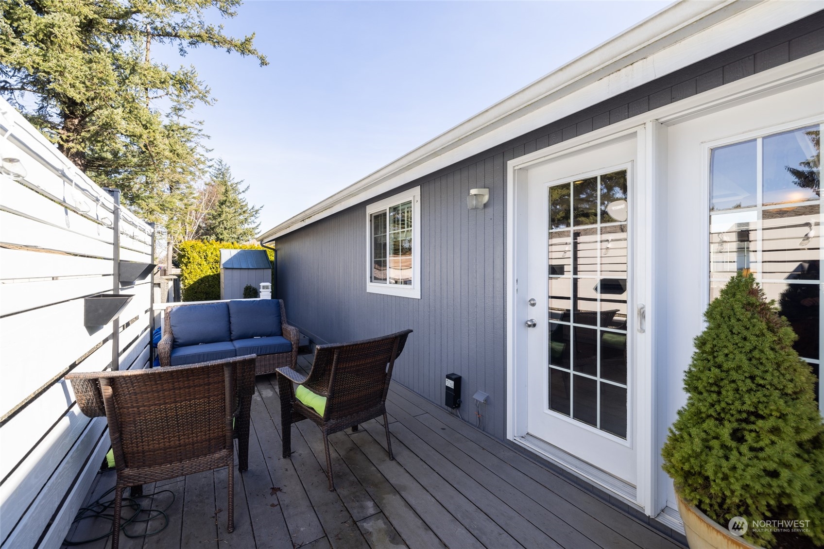 107 South Pass Road, Unit 3 Nooksack, WA 98276 - Photo 28 of 38 a view of a patio with table and chairs and wooden floor