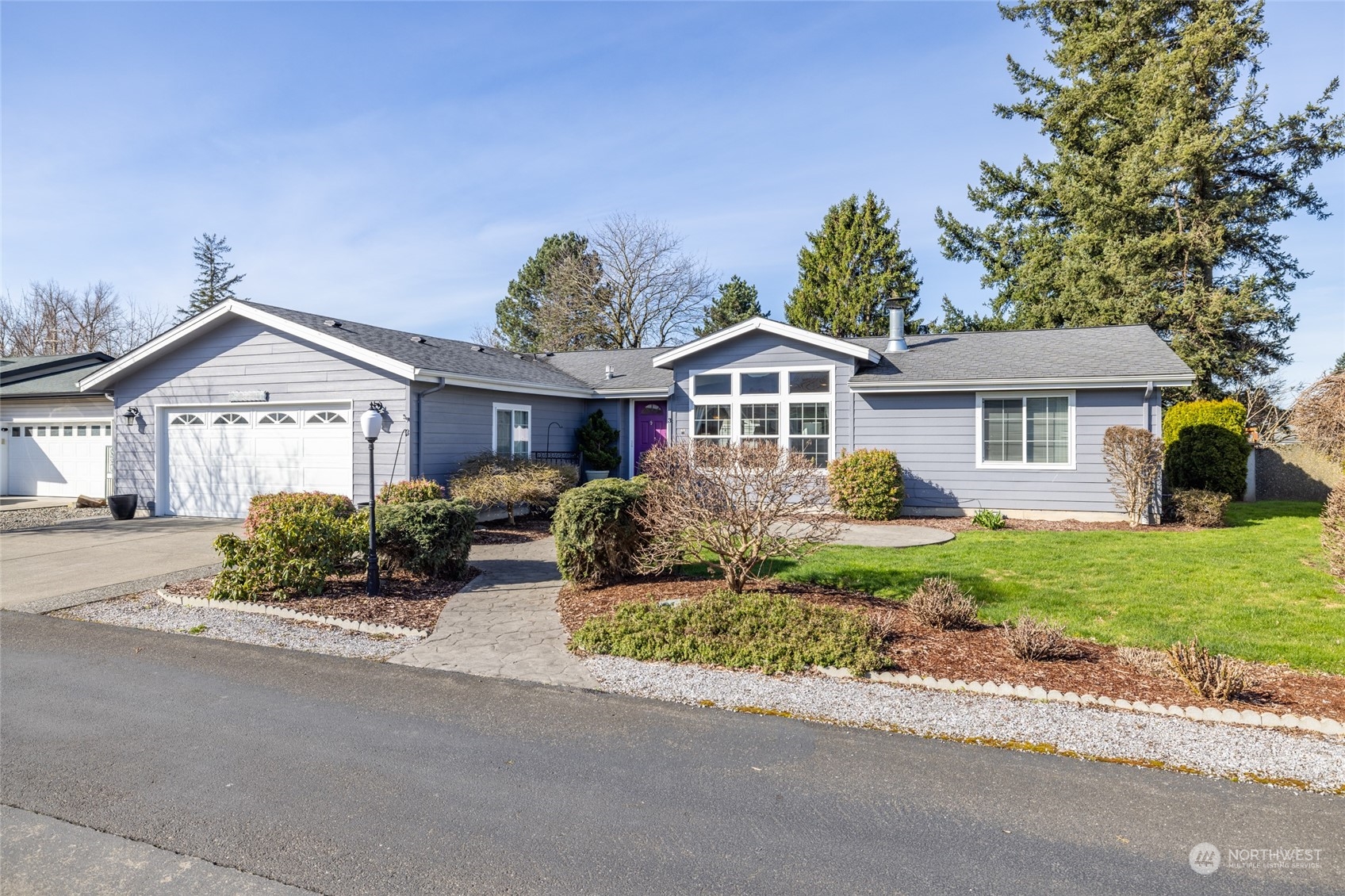 107 South Pass Road, Unit 3 Nooksack, WA 98276 - Photo 34 of 38 a front view of a house with a garden