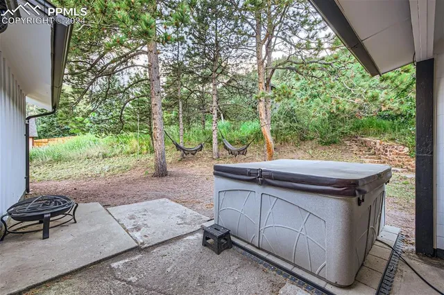 a view of a backyard with furniture and outdoor space
