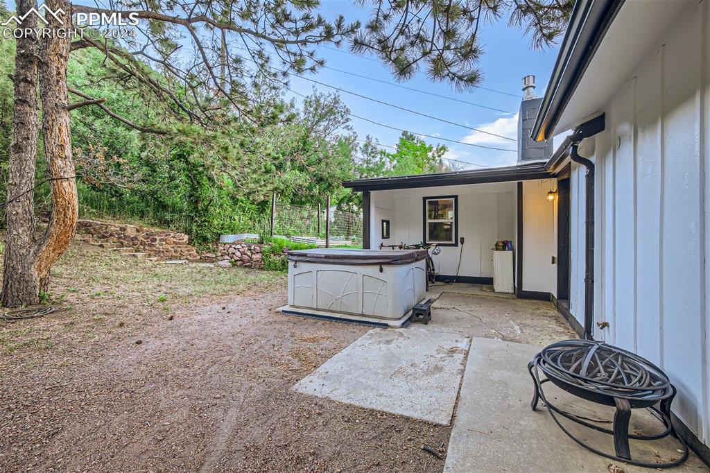 118 Hillside Road Palmer Lake, CO 80133 - Photo 19 of 25 a view of a porch with furniture and a yard