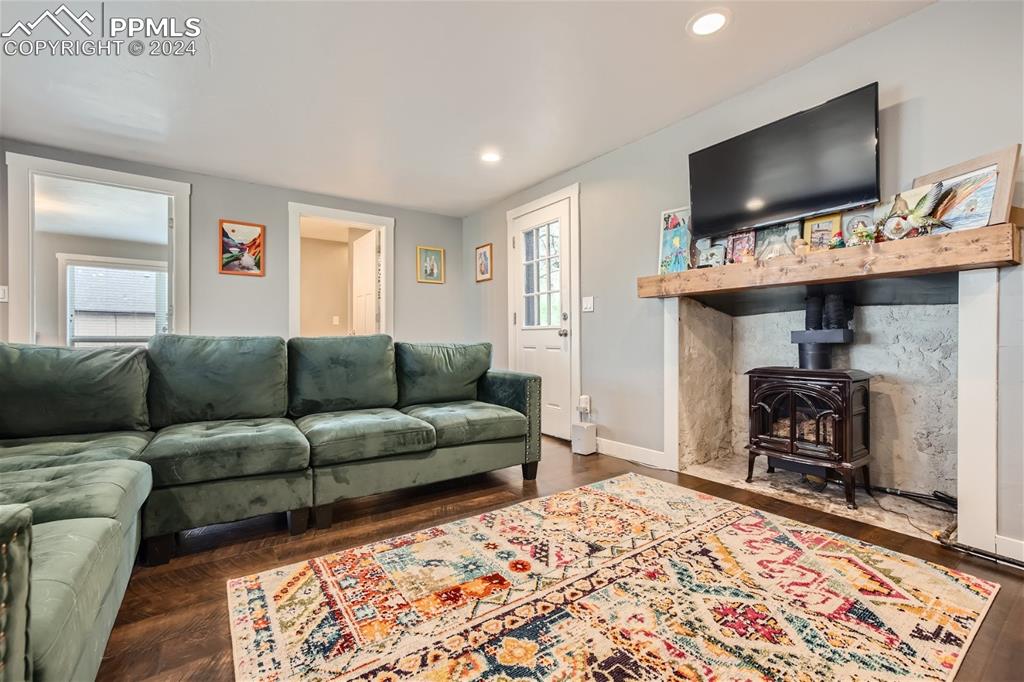 118 Hillside Road Palmer Lake, CO 80133 - Photo 6 of 25 a living room with furniture and a flat screen tv