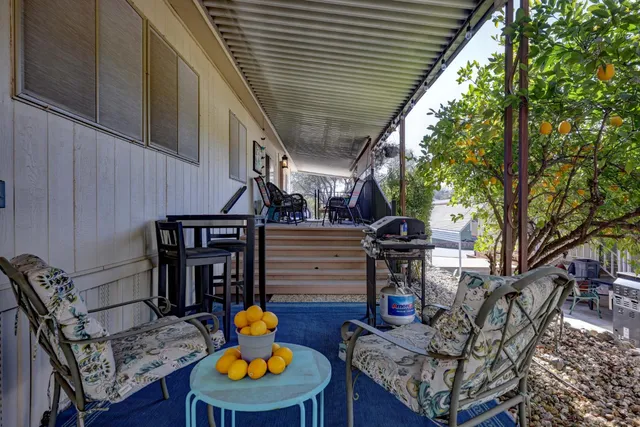 a backyard of a house with seating space