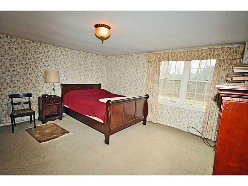 217 Hunt Road Fox Chapel, PA 15215 - Photo 14 of 24 Bedroom. The lower level features an oversized bedroom . Great view of the grounds and back patio