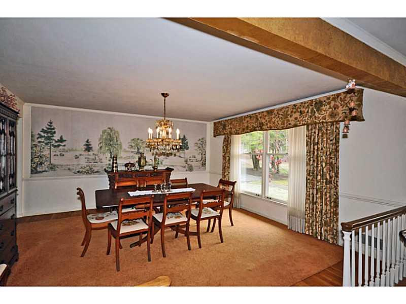 217 Hunt Road Fox Chapel, PA 15215 - Photo 3 of 24 Dining Room. One wide step up from the living room brings you into the formal dining room. Hardwood floors and a beautiful crystal chandelier enhance this space.