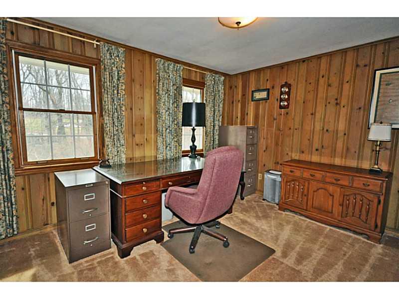 217 Hunt Road Fox Chapel, PA 15215 - Photo 5 of 24 Den. Large Den is highlighted by the knotty pine walls. Lots of space for bookcases or additional furniture.
