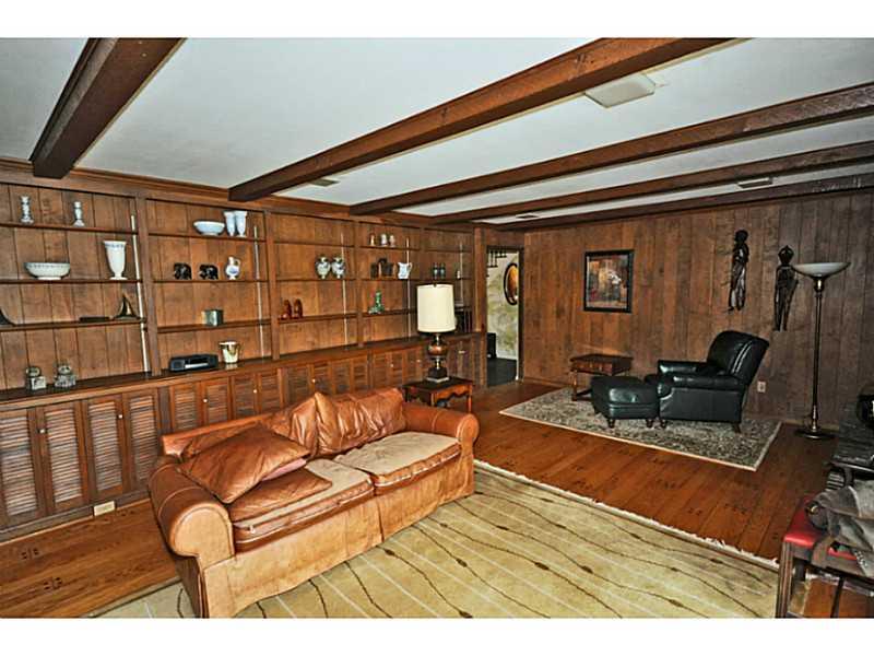 217 Hunt Road Fox Chapel, PA 15215 - Photo 6 of 24 Family Room. Full wall of shelves and cabinets give you plenty of areas for display of your favorite items. Full raised hearth fireplace, hardwood floors and wood paneled walls, beamed ceilings, access to patio/yard.