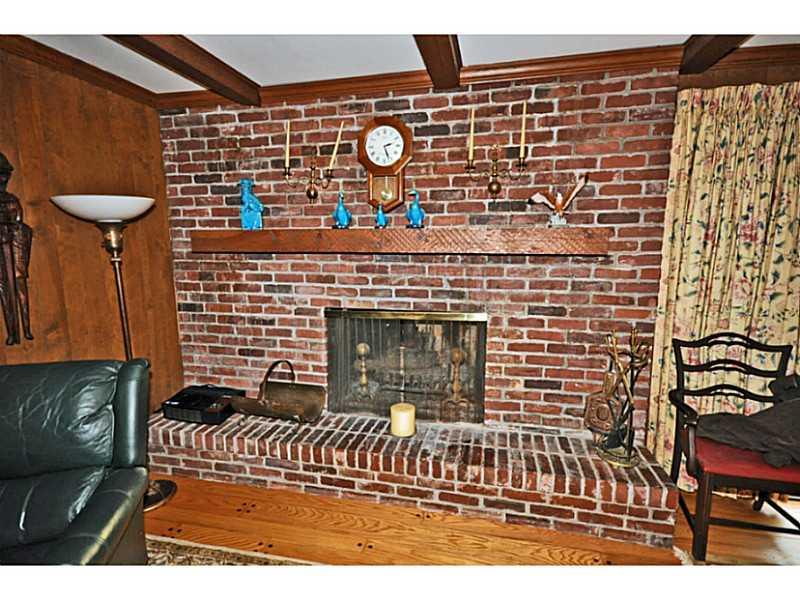 217 Hunt Road Fox Chapel, PA 15215 - Photo 7 of 24 Family Room. This raised hearth and mantle add to the fireplace in the family room.