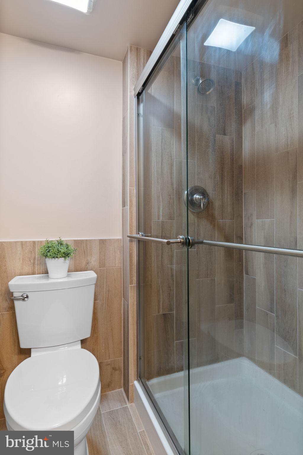 7619 Hayfield Road Alexandria, VA 22315 - Photo 45 of 60 Lower level full bath with upgraded tile