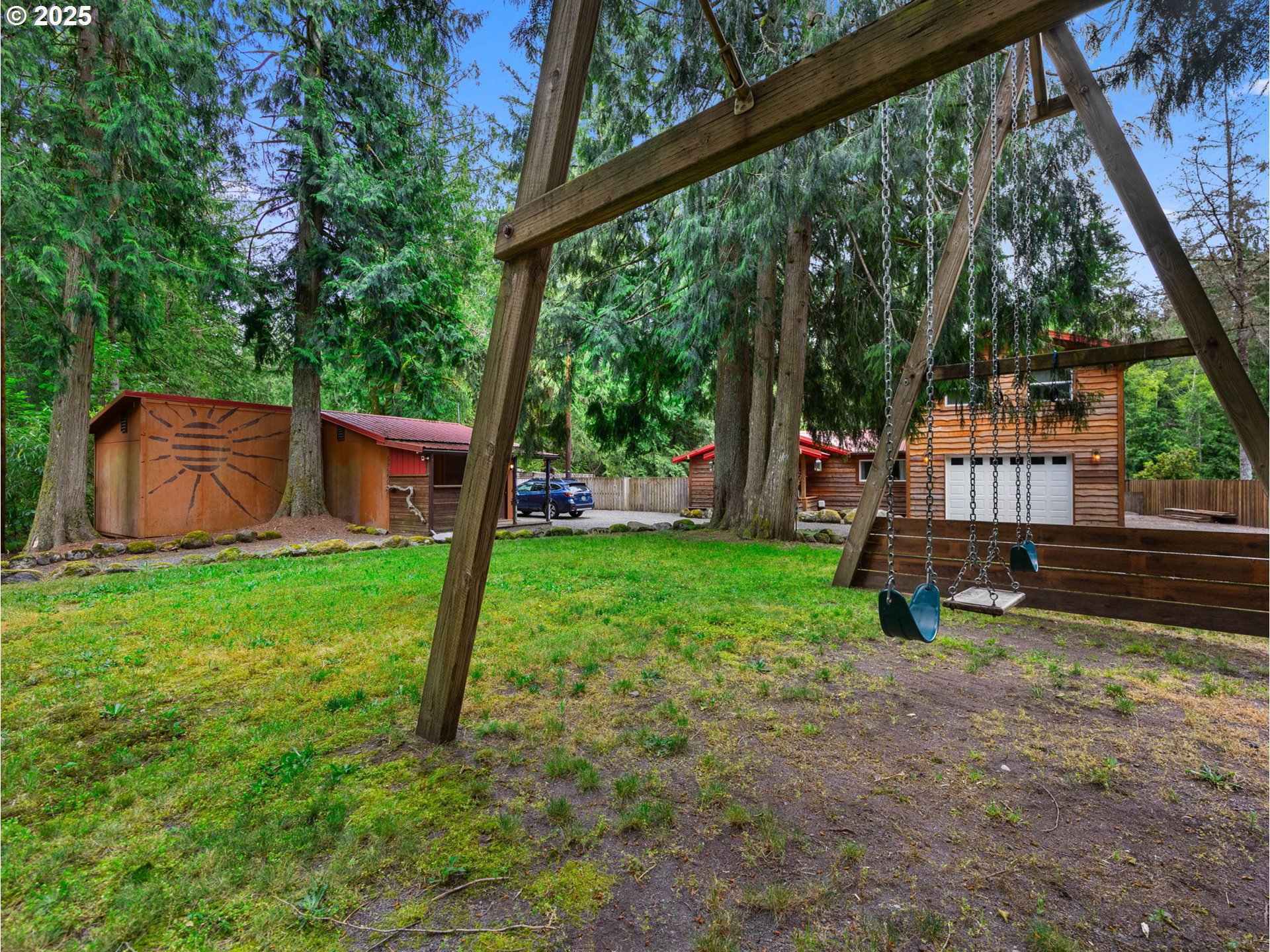 59660 East Marmot Road Sandy, OR 97055 - Photo 39 of 42 a view of a house with backyard and a tree