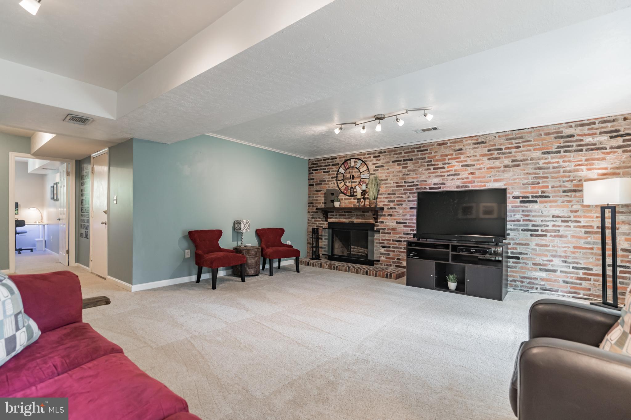 13403 Tamarack Road Silver Spring, MD 20904 - Photo 33 of 47 Family room features a wood burning fireplace.