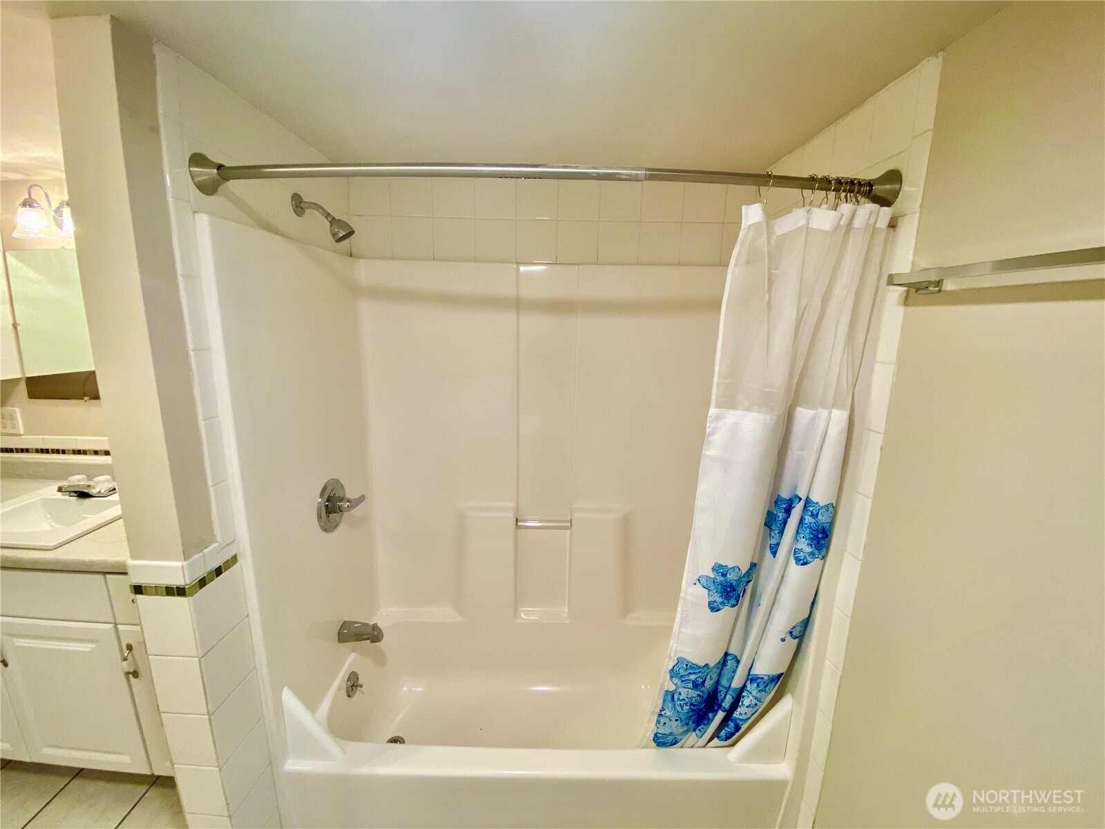 313 Northeast 185th Street Shoreline, WA 98155 - Photo 13 of 24 a bathroom with a bathtub and a shower