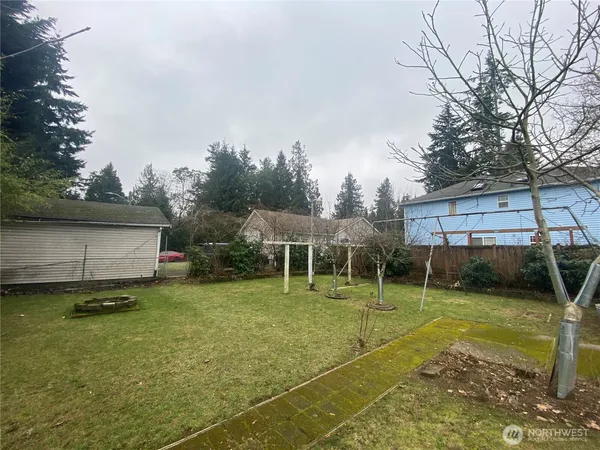 a view of a house with backyard and a slide