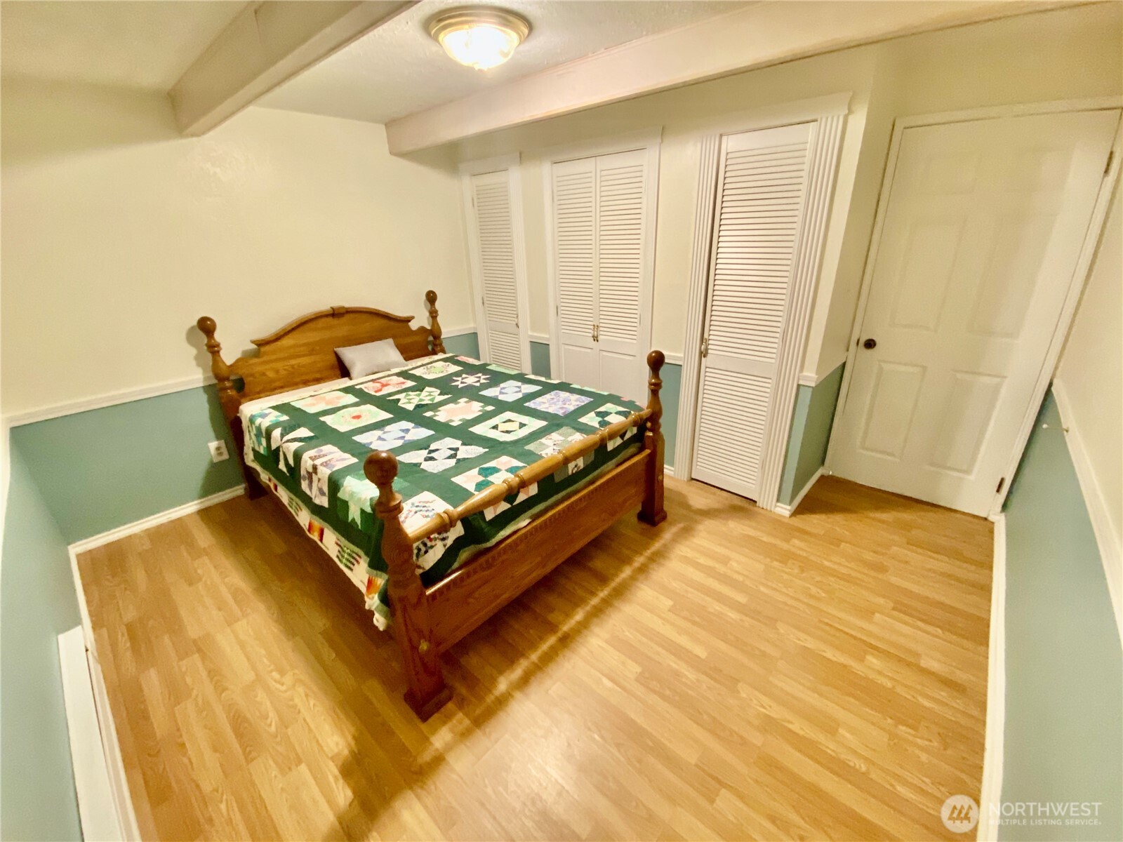 313 Northeast 185th Street Shoreline, WA 98155 - Photo 5 of 24 a bed sitting in a spacious bedroom next to a window