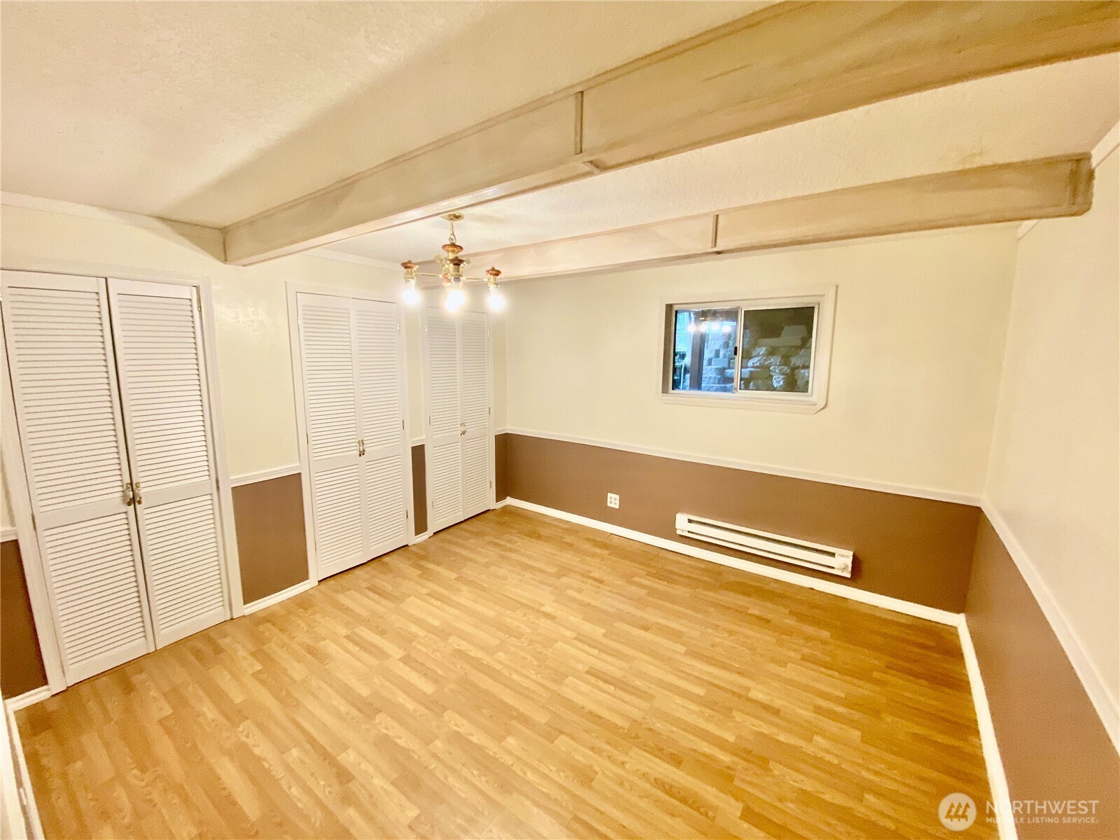 313 Northeast 185th Street Shoreline, WA 98155 - Photo 7 of 24 a view of a room with a wooden floor