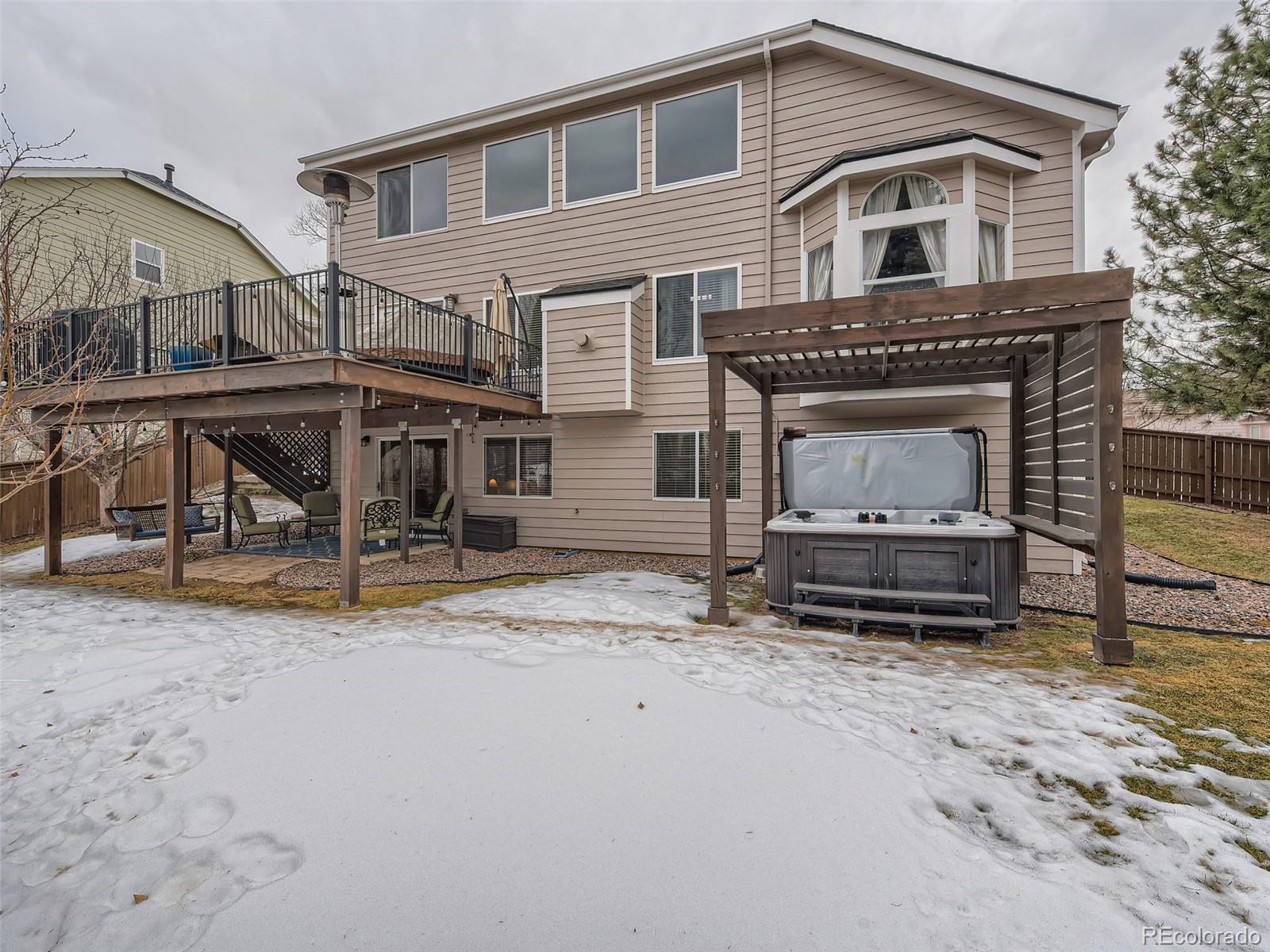 9724 Chanteclair Circle Highlands Ranch, CO 80126 - Photo 28 of 28 a view of a house with a yard and sitting area