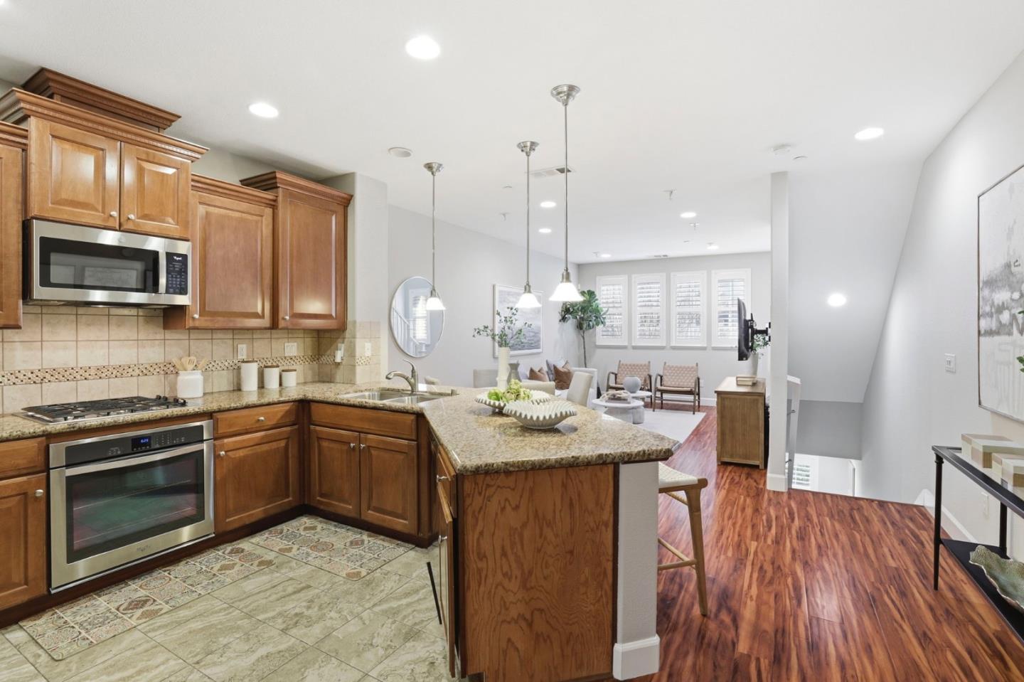 1701 Shore Place, Unit 5 Santa Clara, CA 95054 - Photo 11 of 32 a kitchen with stainless steel appliances granite countertop a sink a stove and a wooden floors
