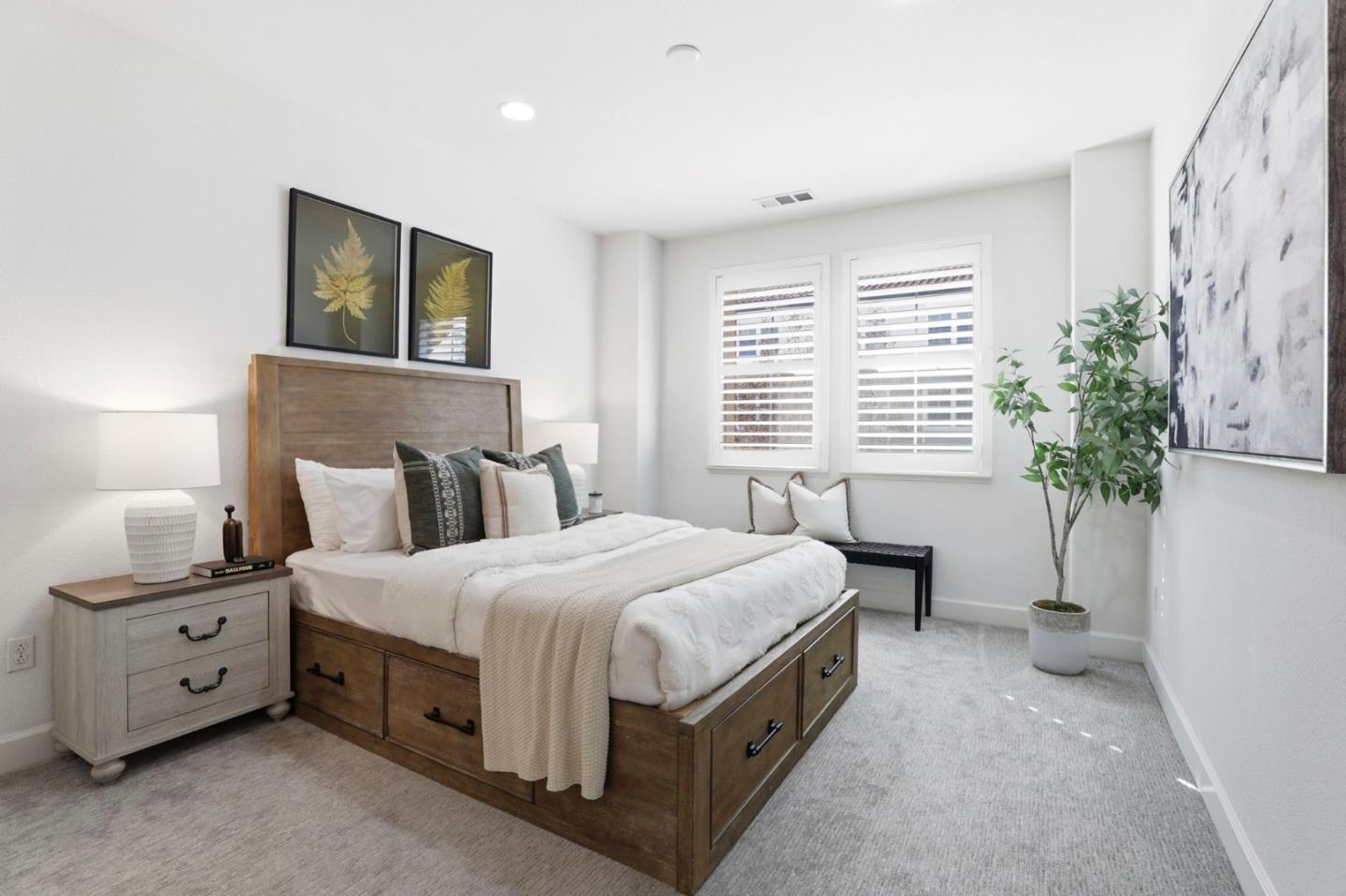 1701 Shore Place, Unit 5 Santa Clara, CA 95054 - Photo 16 of 32 a bedroom with a large bed and a potted plant