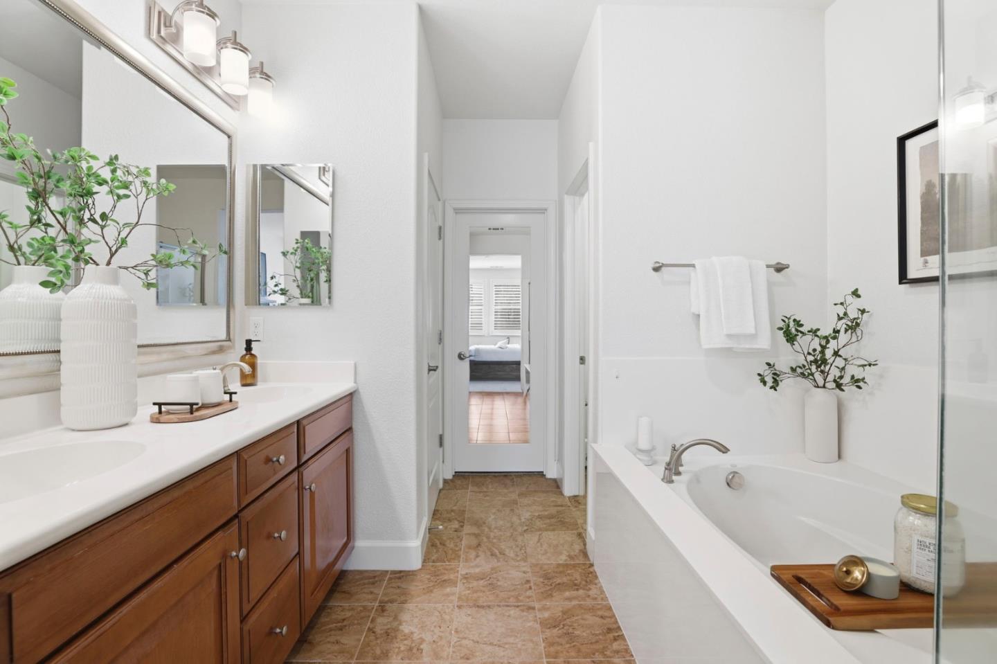 1701 Shore Place, Unit 5 Santa Clara, CA 95054 - Photo 18 of 32 a bathroom with a tub sink and mirror
