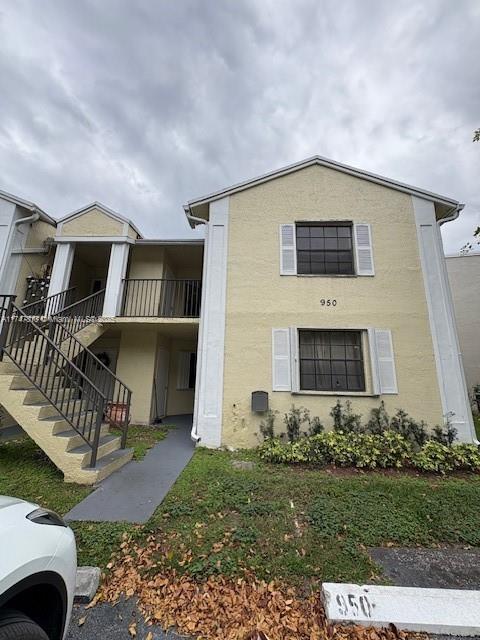 a front view of house with yard and outdoor seating