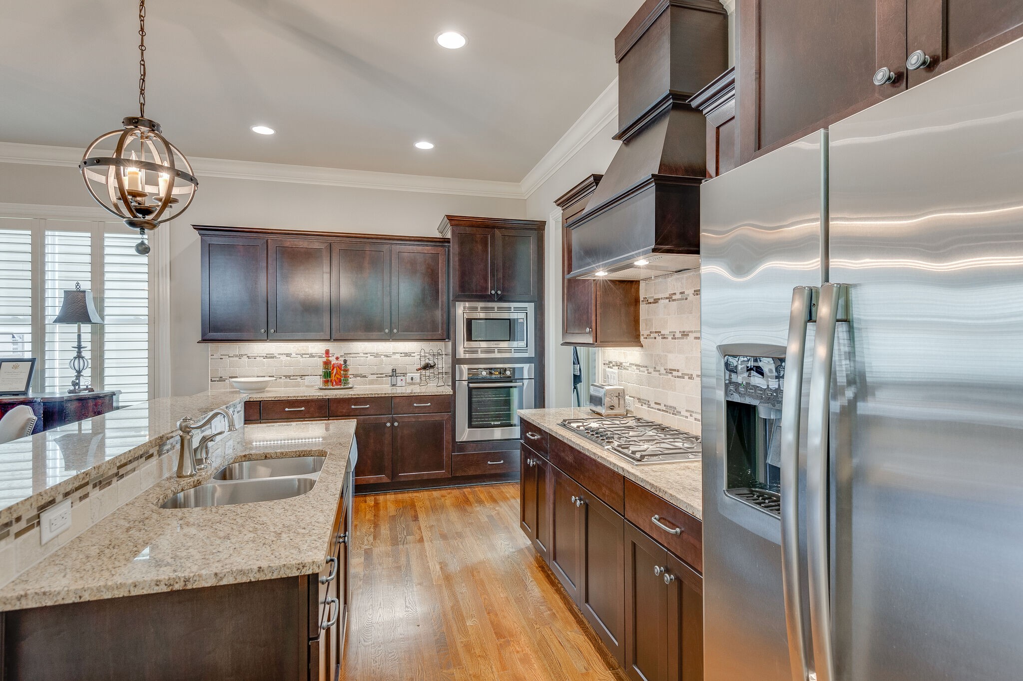 324 Fitzgerald Street Franklin, TN 37064 - Photo 12 of 39 a kitchen with stainless steel appliances granite countertop a refrigerator a stove and a sink