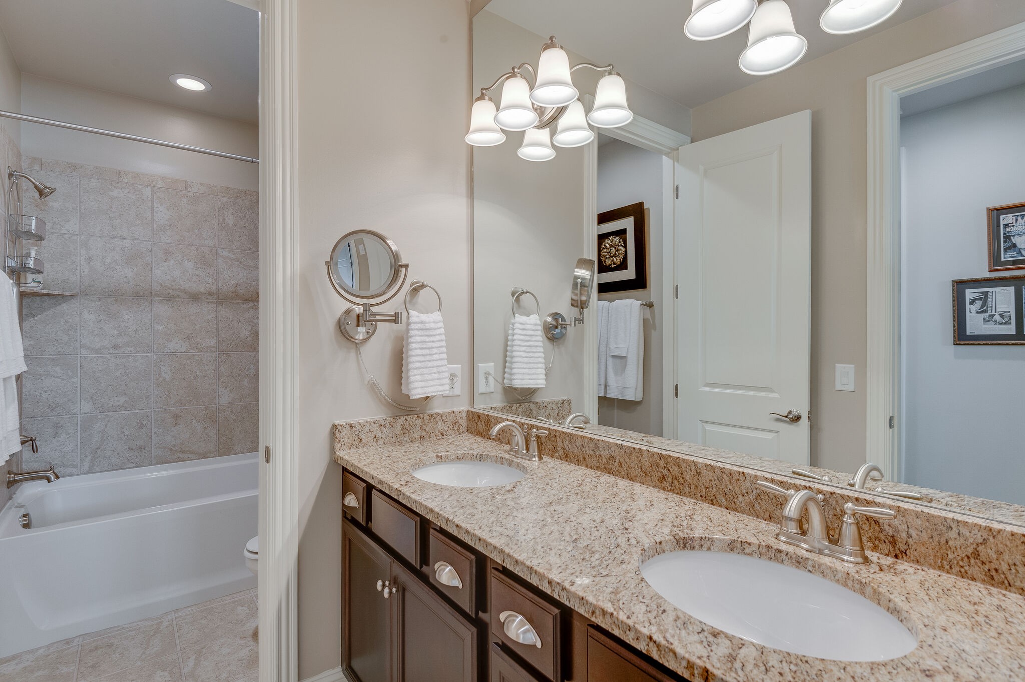 324 Fitzgerald Street Franklin, TN 37064 - Photo 31 of 39 a bathroom with a granite countertop sink a large mirror and a bathtub