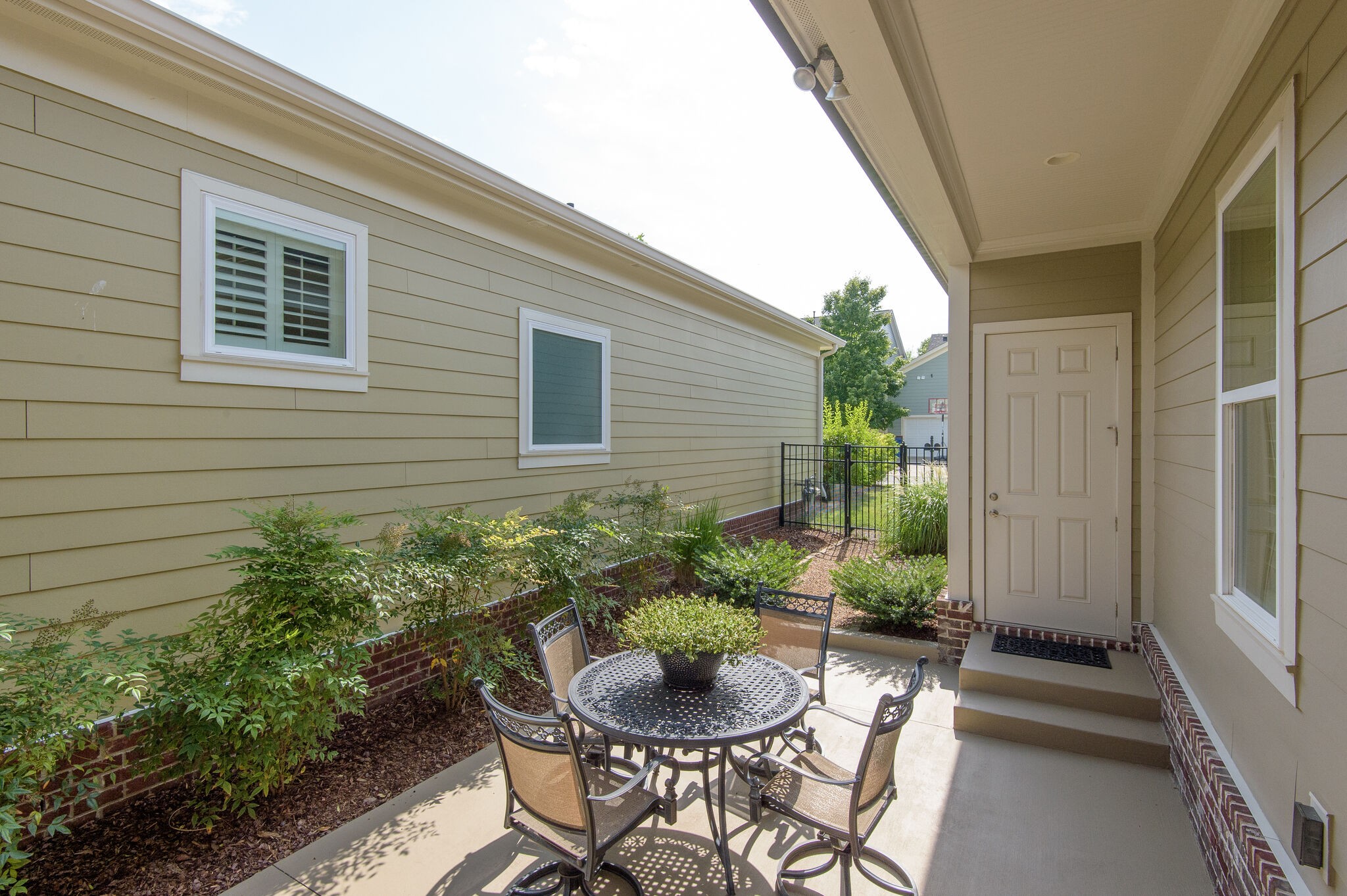 324 Fitzgerald Street Franklin, TN 37064 - Photo 32 of 39 a view of a patio with table and chairs and potted plants