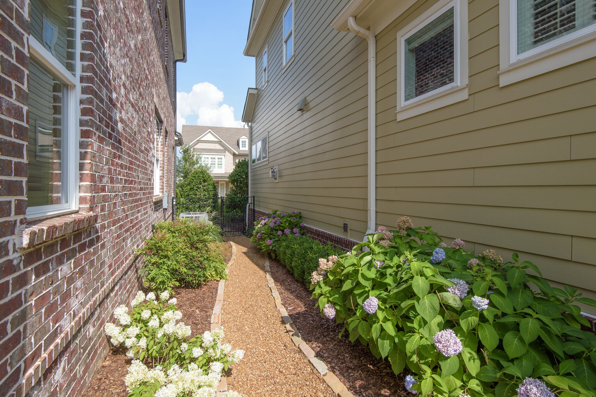 324 Fitzgerald Street Franklin, TN 37064 - Photo 34 of 39 a view of a pathway that has flower in front of a house