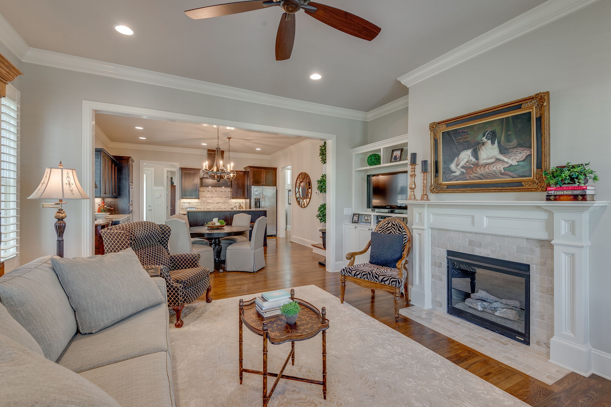 324 Fitzgerald Street Franklin, TN 37064 - Photo 8 of 39 a living room with furniture a flat screen tv and a fireplace