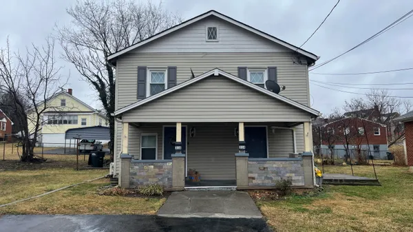 a front view of house with a yard