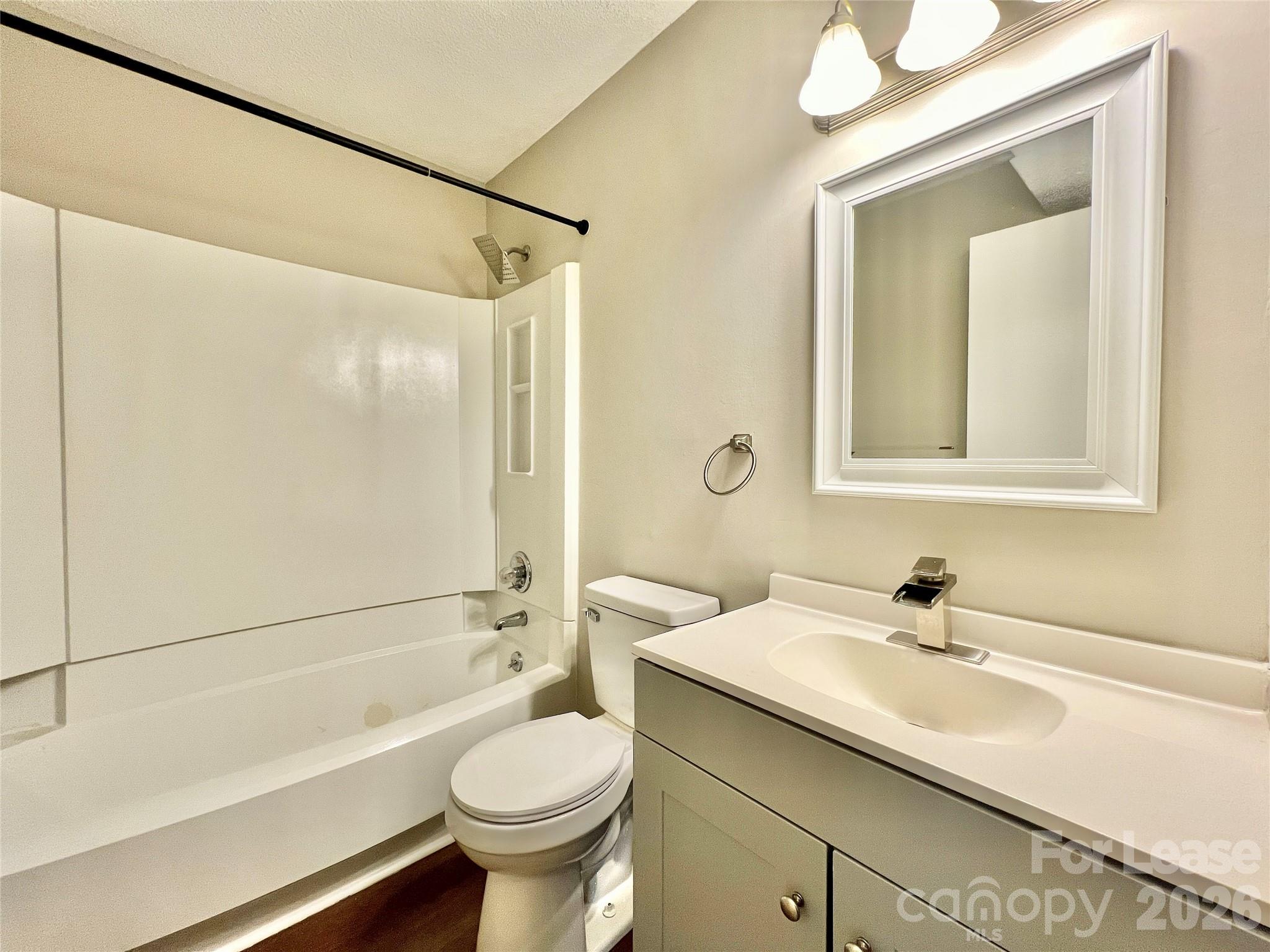 11084 Harrowfield Road Charlotte, NC 28226 - Photo 23 of 31 a bathroom with a sink a toilet and shower