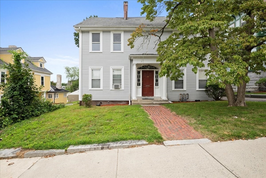 36 Cedar Street, Unit 2A Worcester, MA 01609 - Photo 18 of 25 front view of a house with a yard