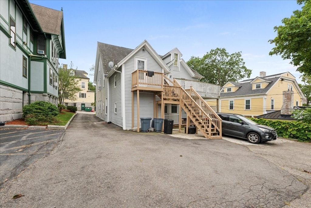 36 Cedar Street, Unit 2A Worcester, MA 01609 - Photo 21 of 25 a front view of a house with a yard