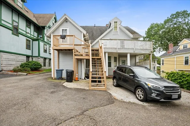 a front view of a house with a yard and a garage