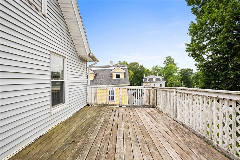 36 Cedar Street, Unit 2A Worcester, MA 01609 - Photo 9 of 25 a view of a wooden deck with a yard
