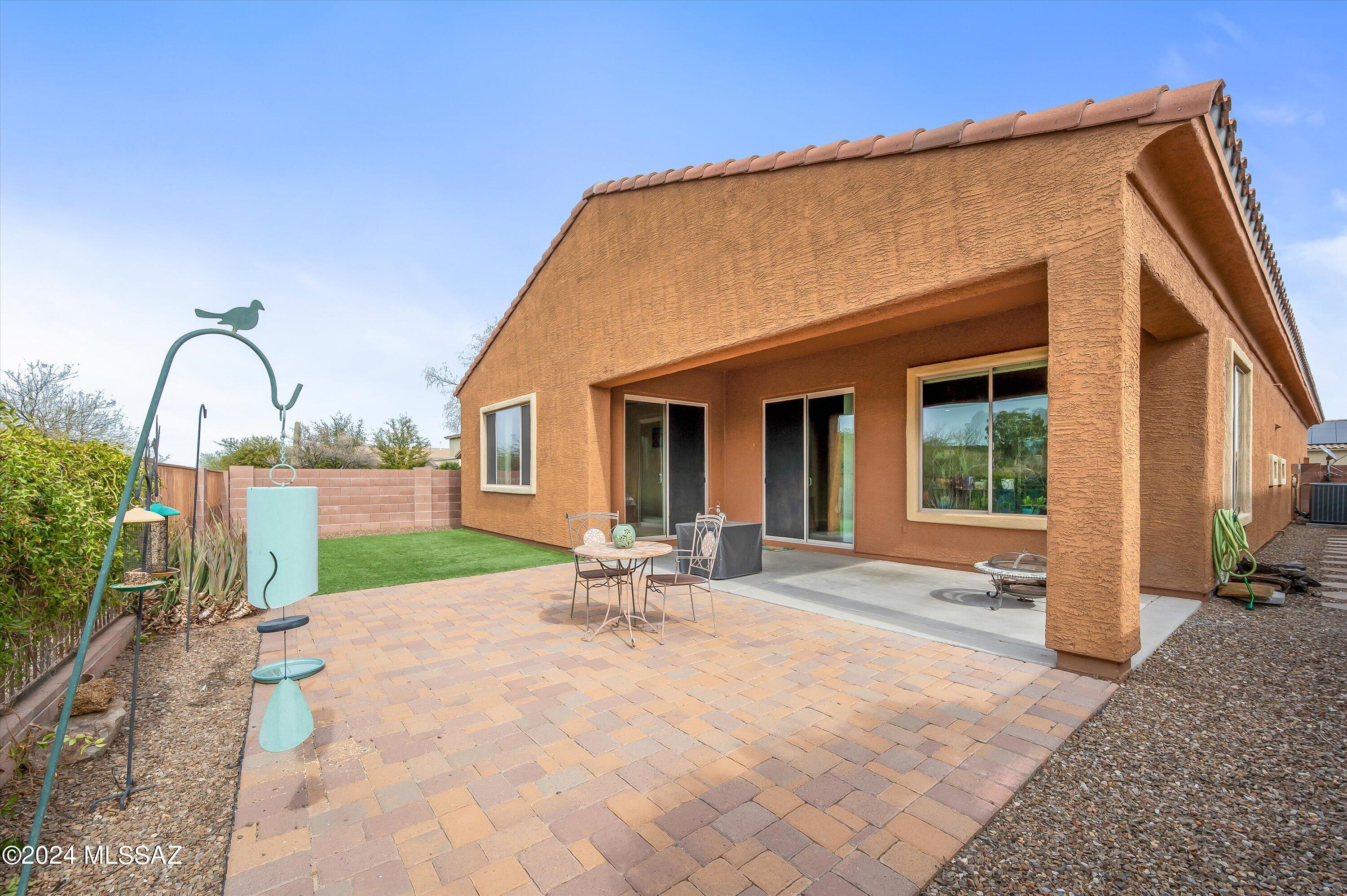 8579 North Shadow Wash Way Tucson, AZ 85743 - Photo 30 of 34 a view of house with backyard and outdoor seating