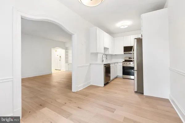 a view of kitchen with wooden floor